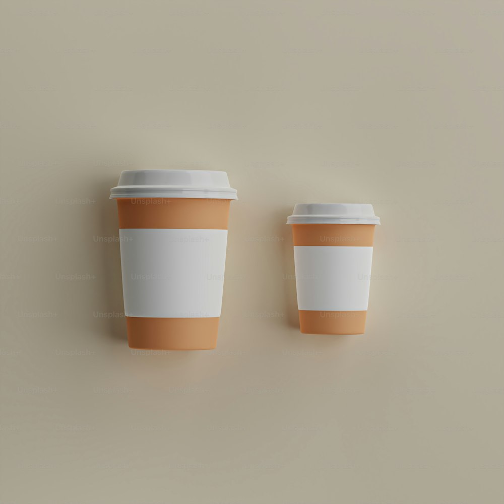 two coffee cups sitting next to each other