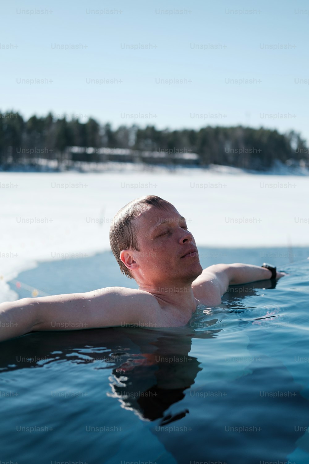 a man laying in a pool of water