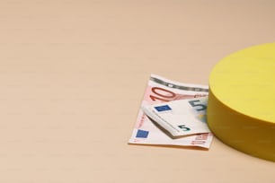 a piece of paper sitting on top of a yellow object