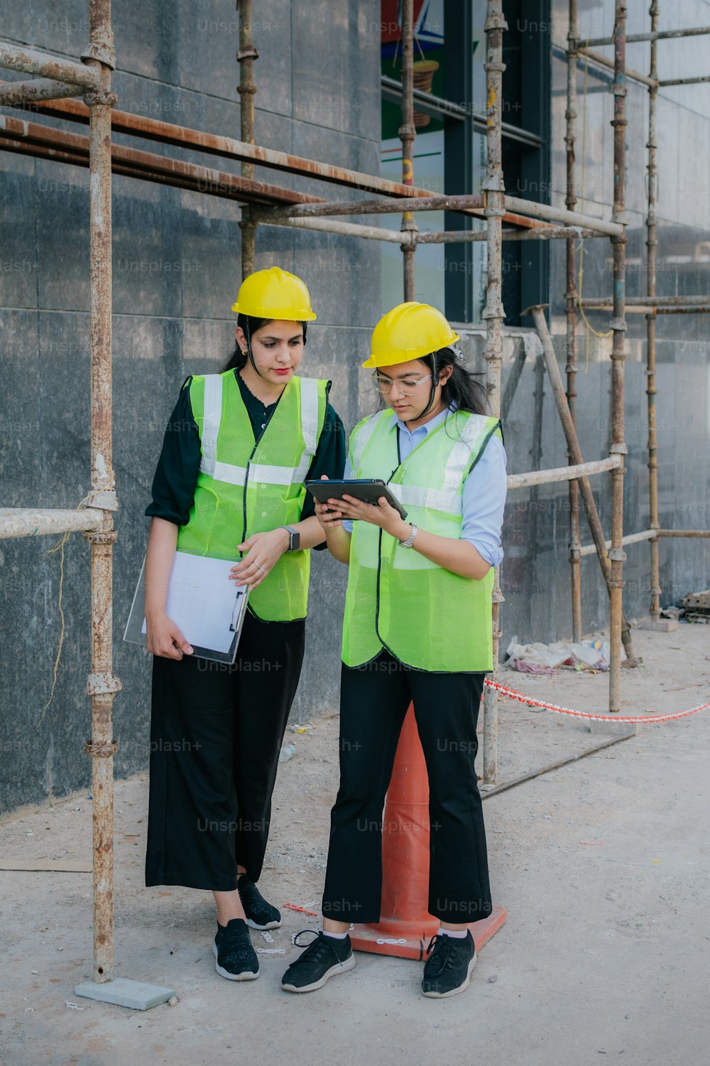 a couple of women standing next to each other