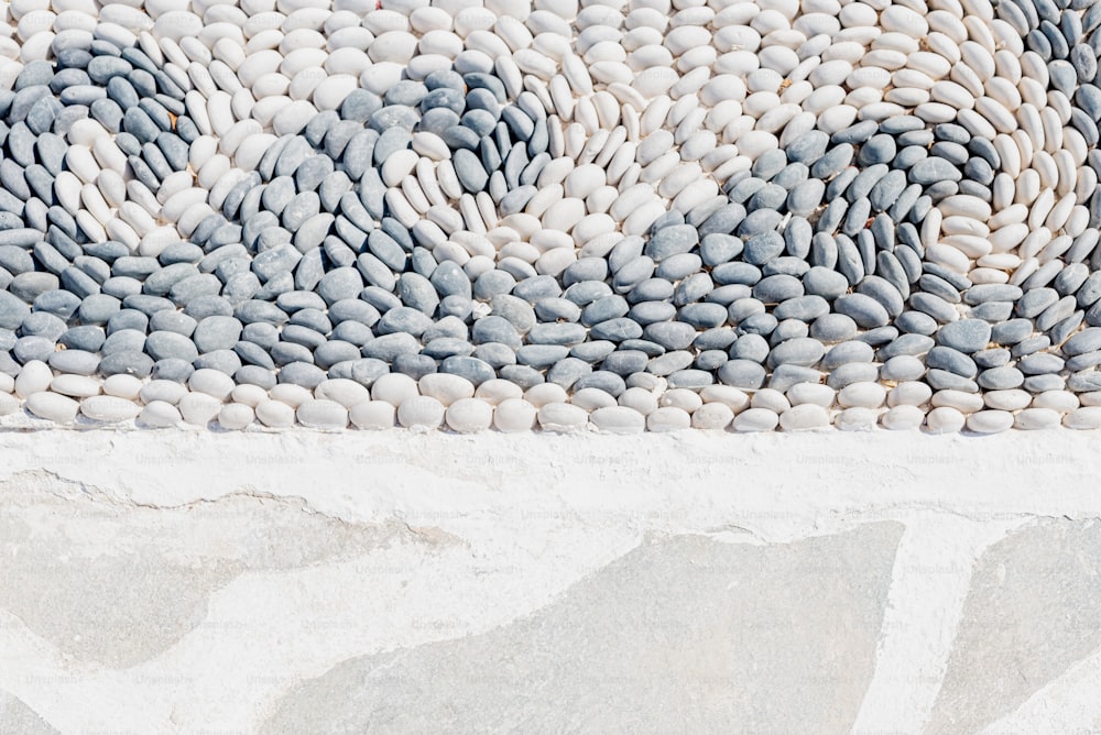 a close up of a rug made of pebbles