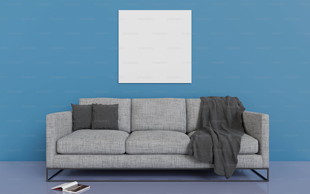 una sala de estar con un sofá gris y una pared azul