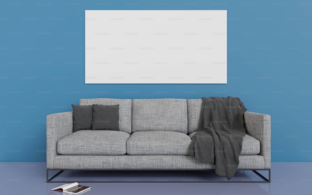 a living room with a gray couch and a blue wall