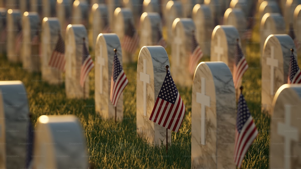 Ein Feld voller Grabsteine mit amerikanischen Flaggen darauf