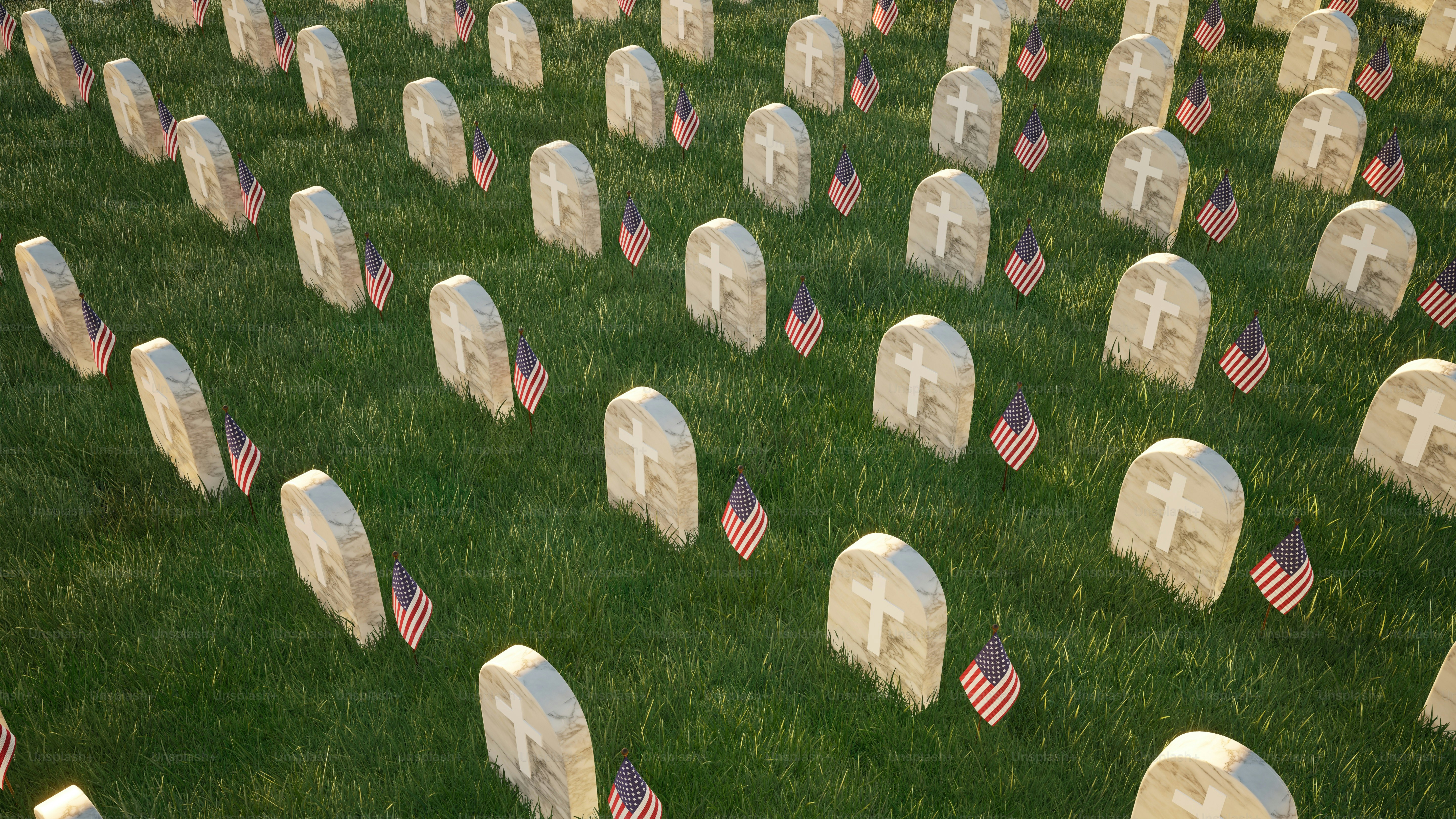 a field of headstones with american flags on them