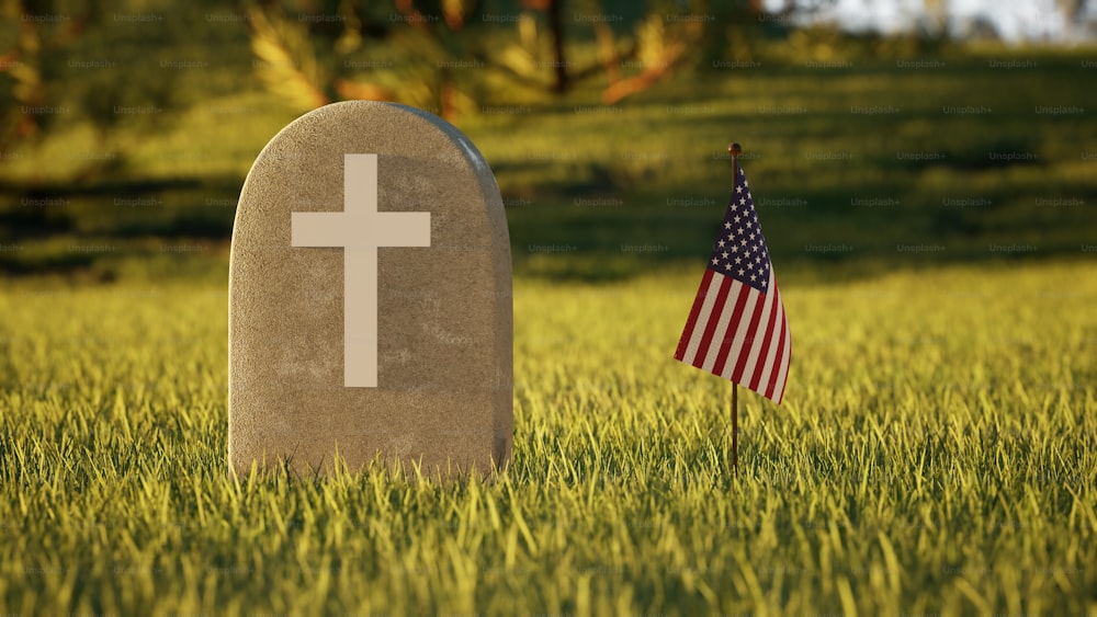 Una tumba con una bandera estadounidense al lado