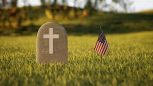 Une tombe avec un drapeau américain à côté