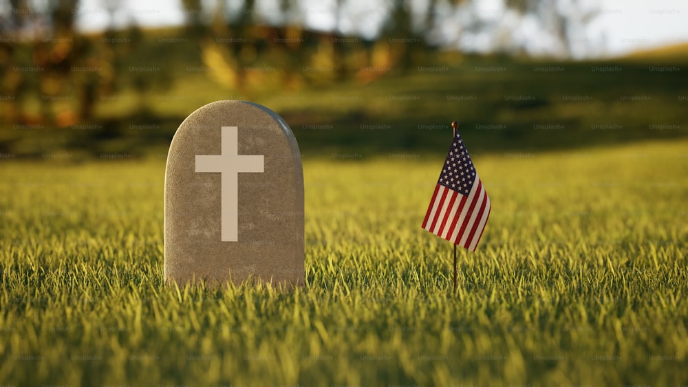 a grave with an american flag next to it