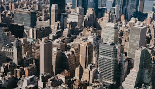 an aerial view of a city with tall buildings