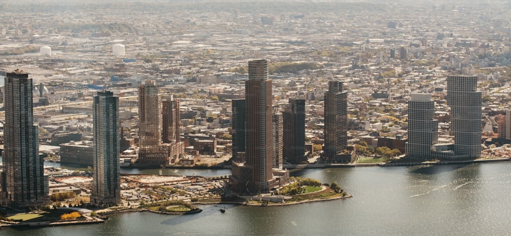 an aerial view of a city and a body of water