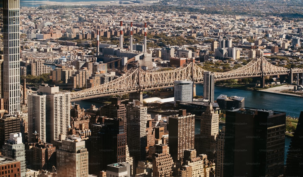 an aerial view of a city and a bridge