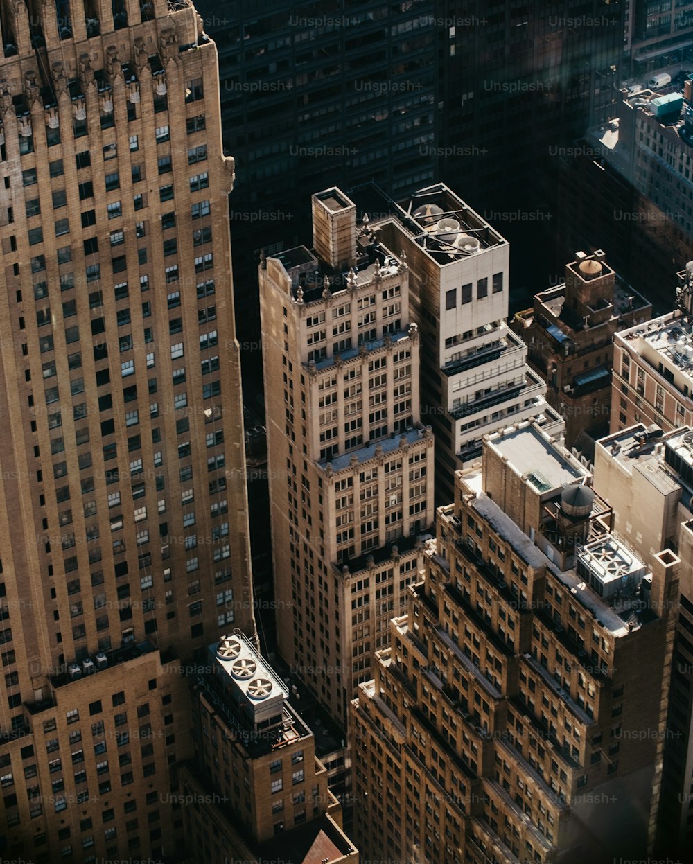an aerial view of a city with tall buildings