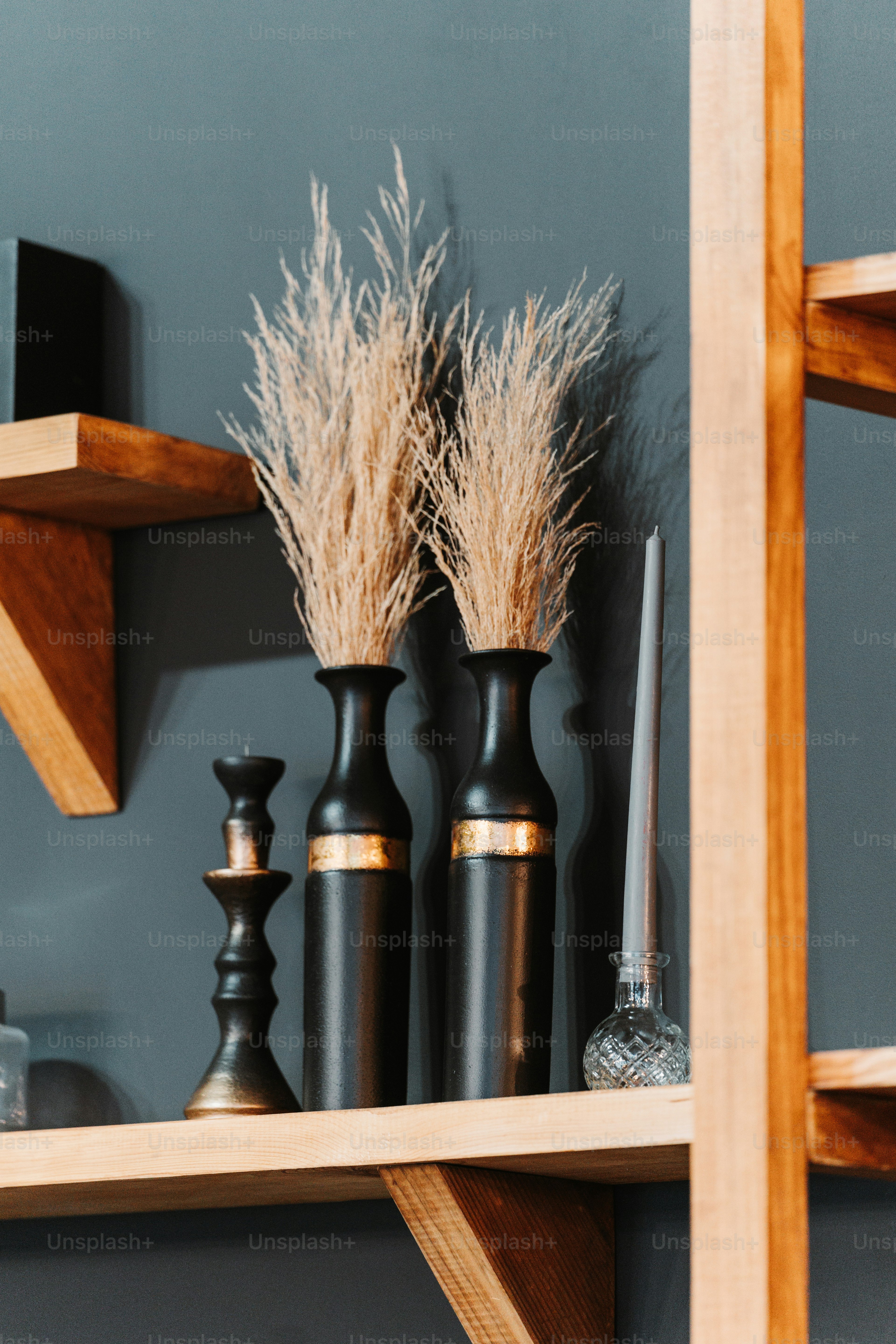 a shelf with vases and other items on it