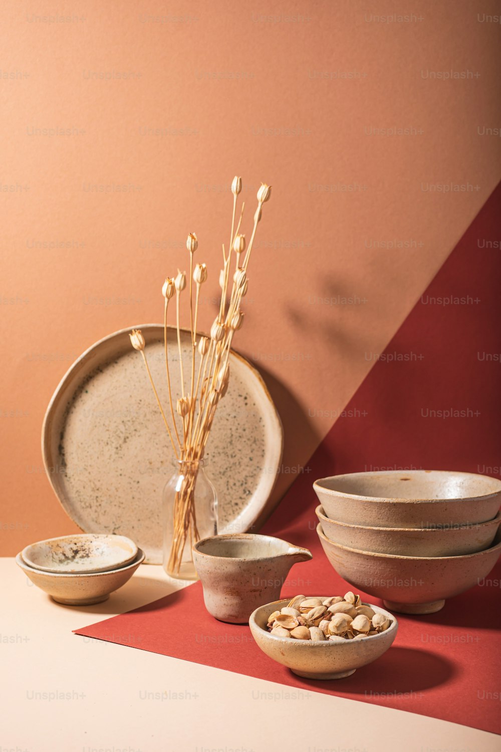 a table topped with plates and bowls filled with food