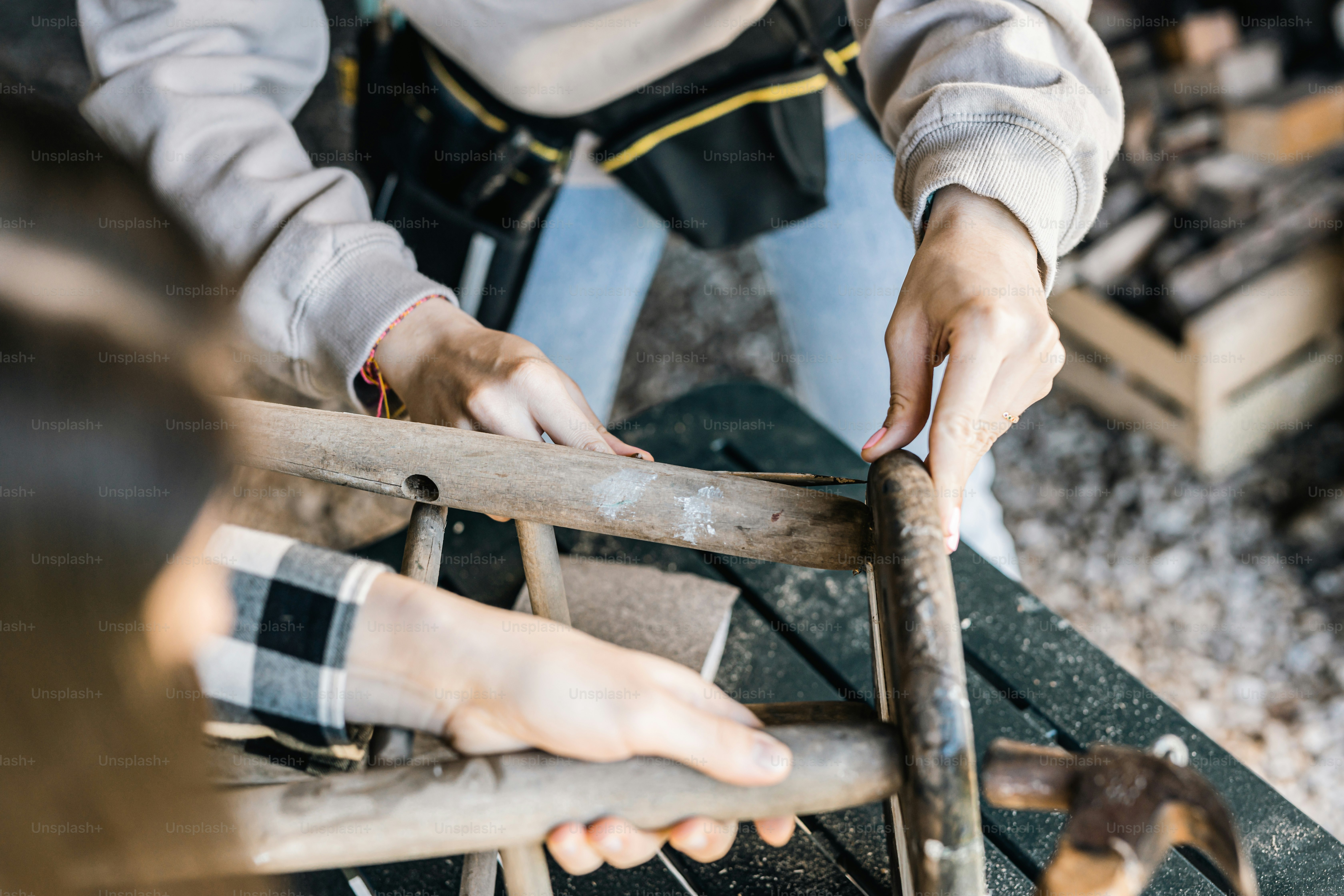 A woman working on a piece of wood photo – Furniture Image on Unsplash