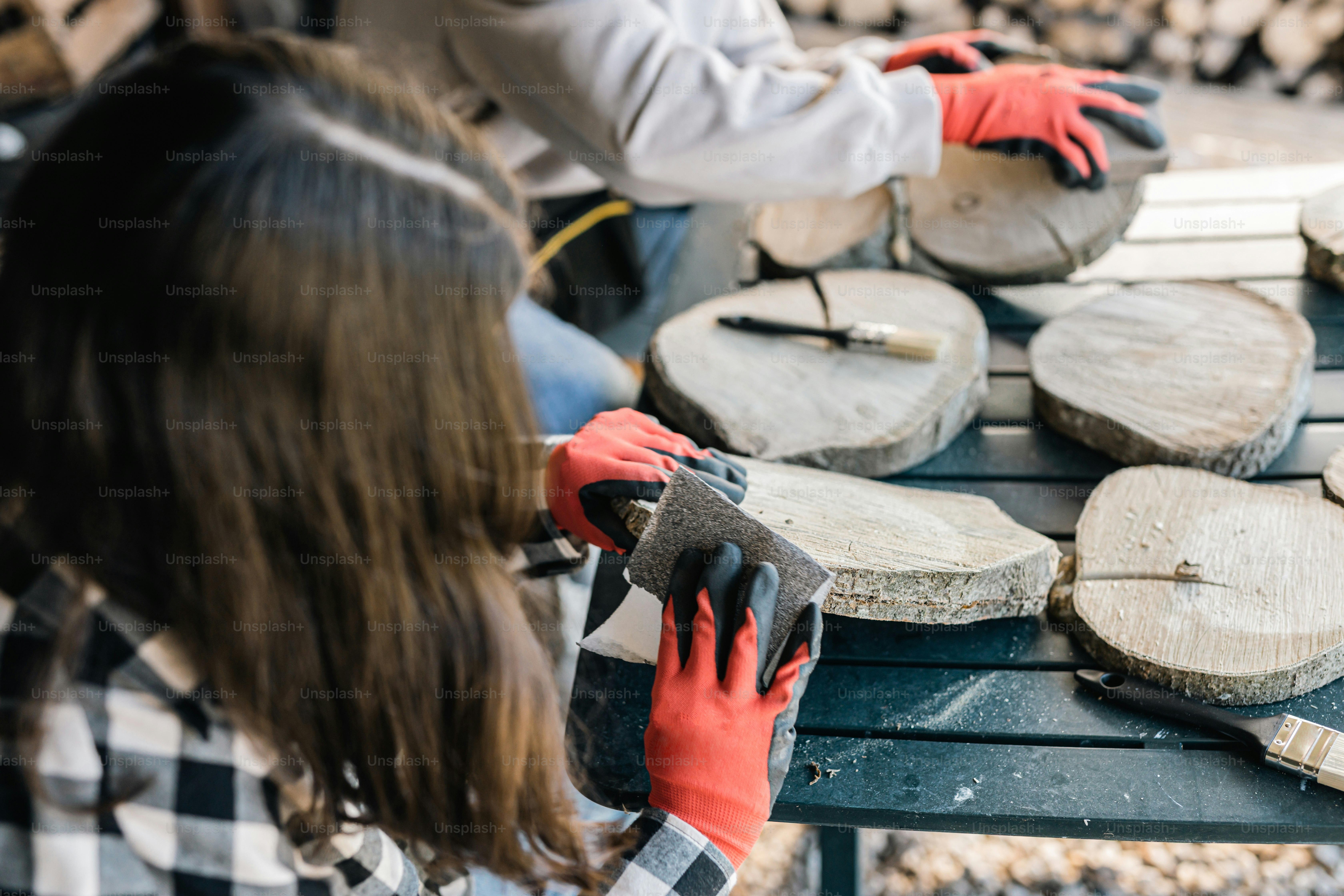 a woman in red gloves is playing a musical instrument