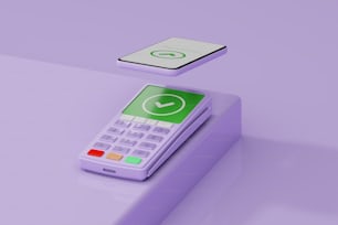 Una calculadora sentada encima de una mesa púrpura