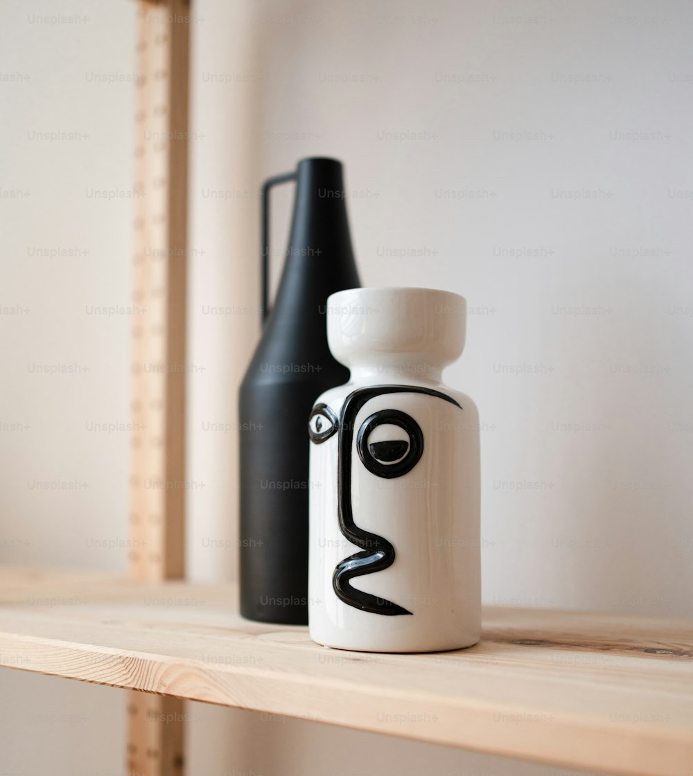 a couple of bottles sitting on top of a wooden shelf