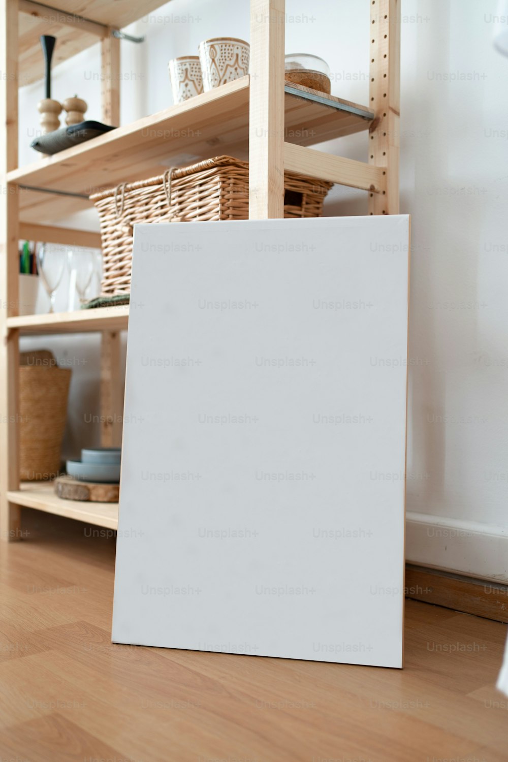a white board on a wooden floor in a room