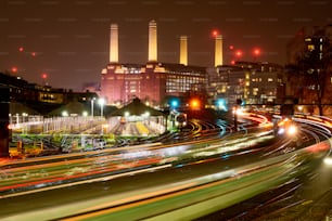 a city skyline at night with a lot of traffic