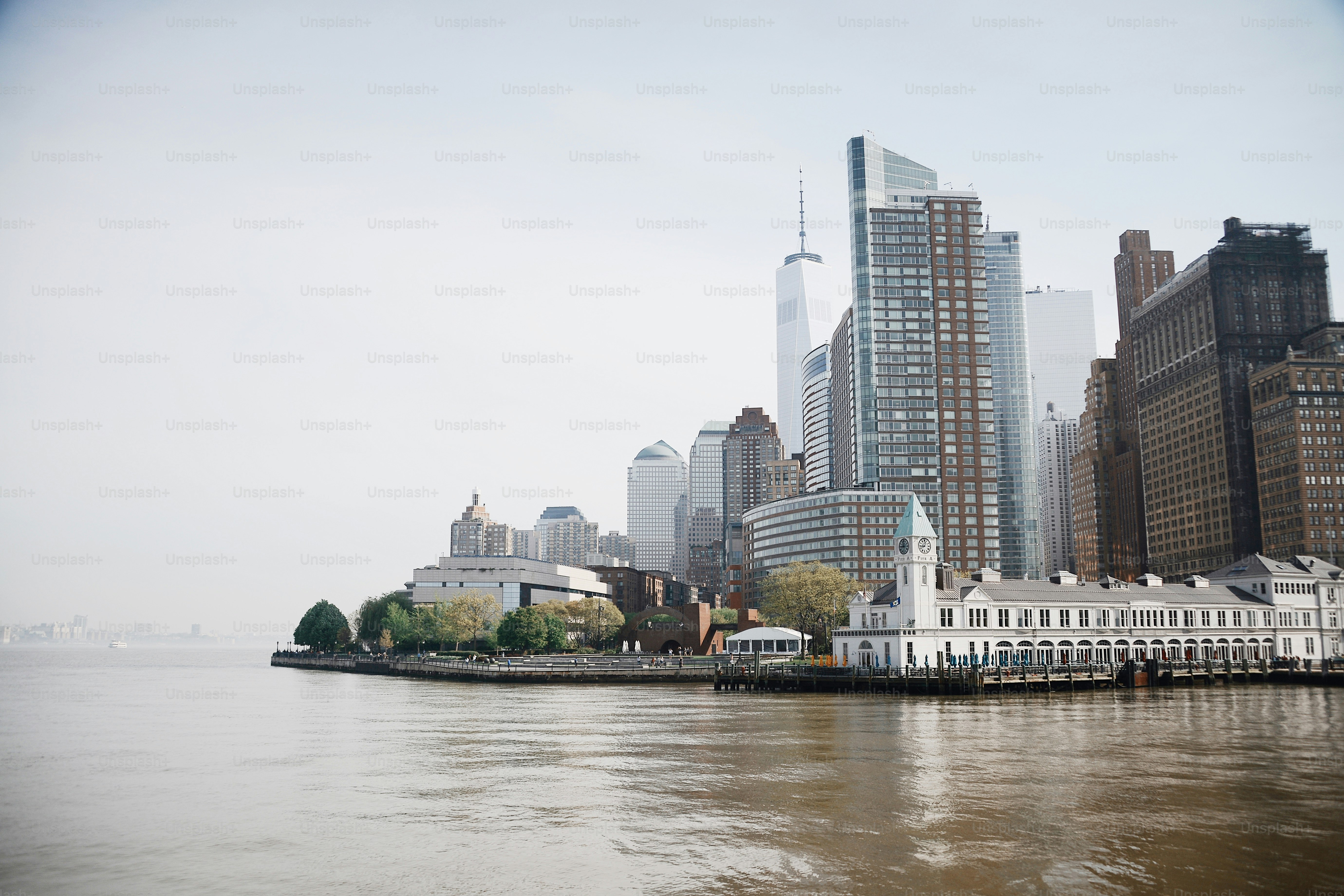 a body of water with a city in the background