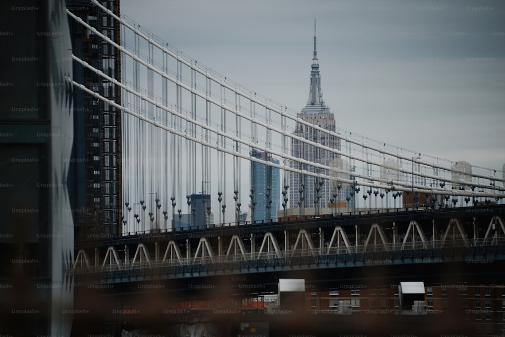 a view of a bridge with a building in the background