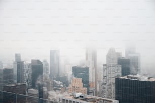 a foggy view of a city with tall buildings
