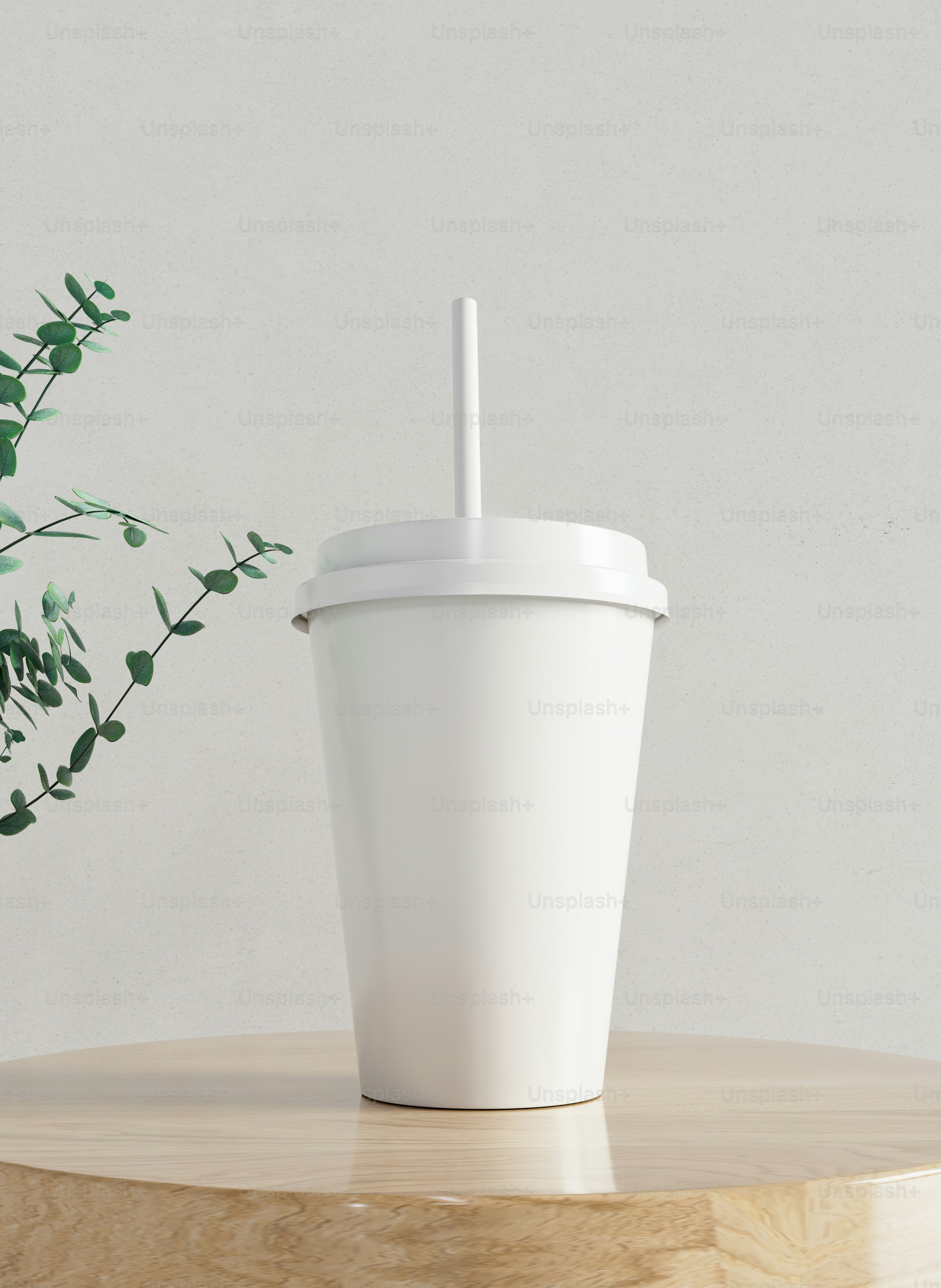 a white cup sitting on top of a wooden table