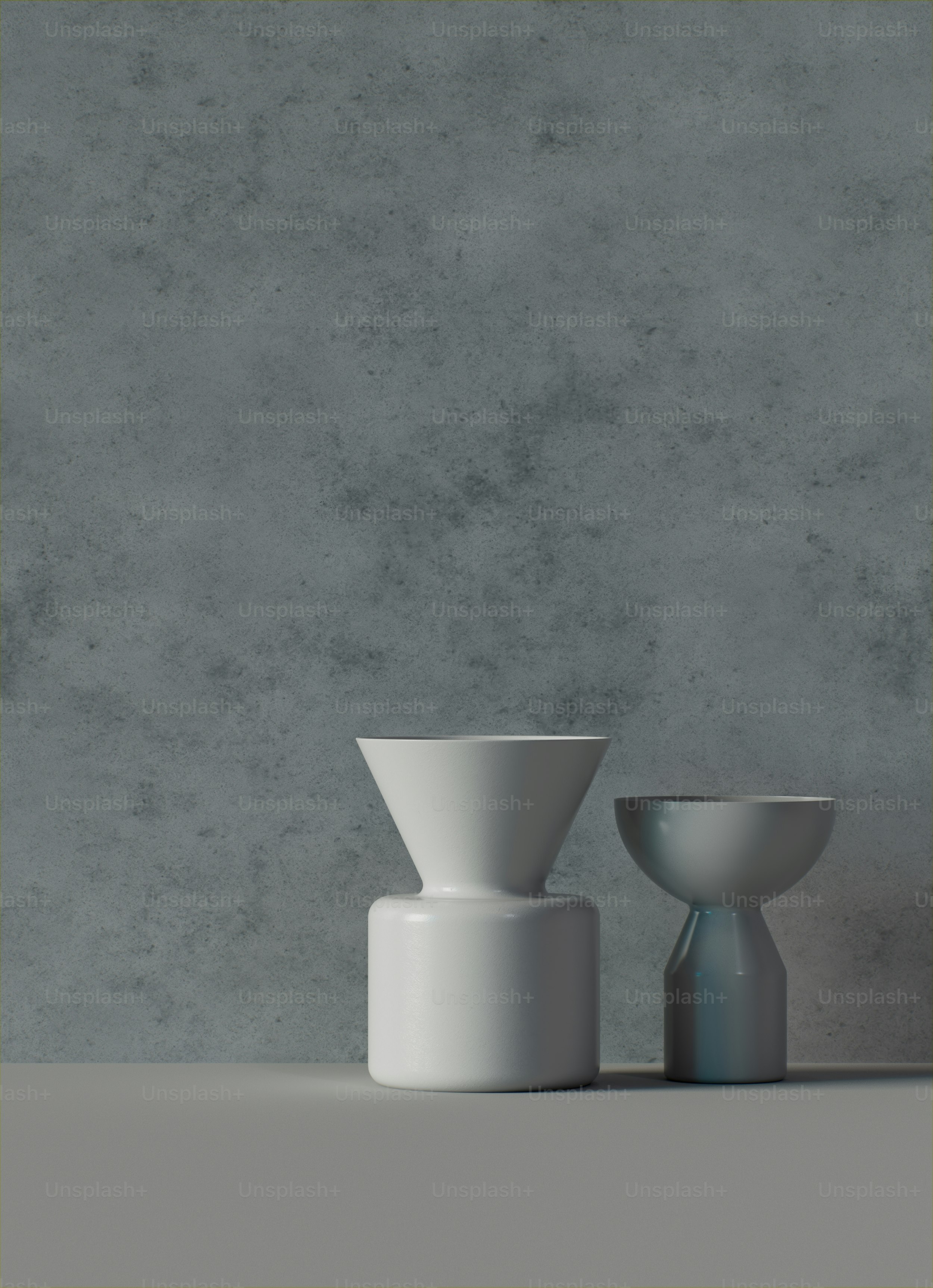A couple of white vases sitting on top of a table photo – Pottery Image ...