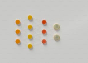 a group of oranges and yellows sitting on top of a white surface