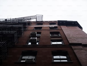 a tall brick building with lots of windows