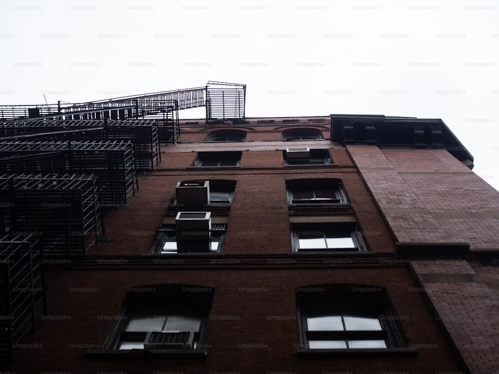 a tall brick building with lots of windows