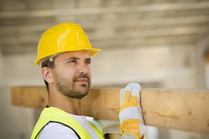 Construction worker is working on new house