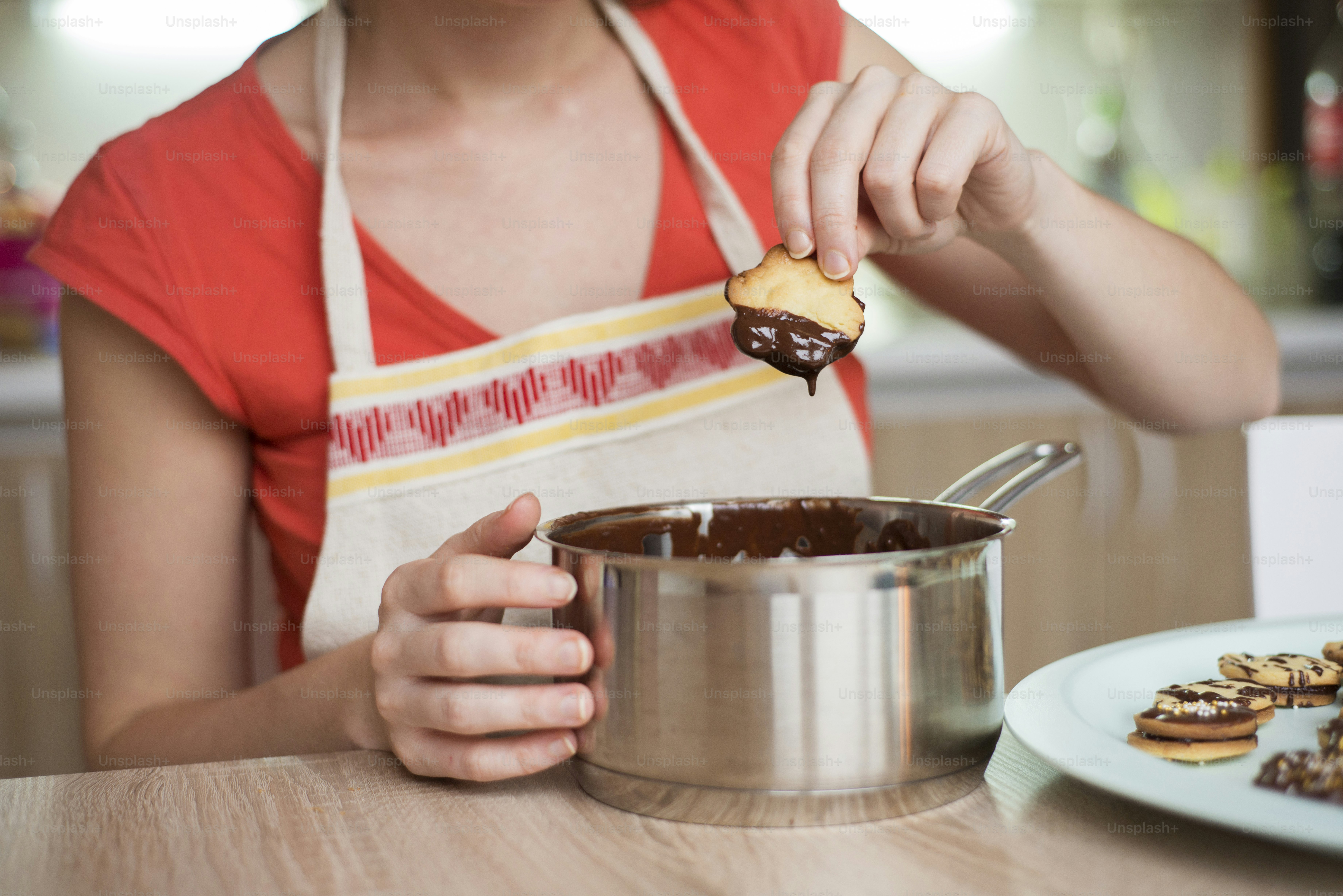 Woman is making christmas cakes in the kitchen