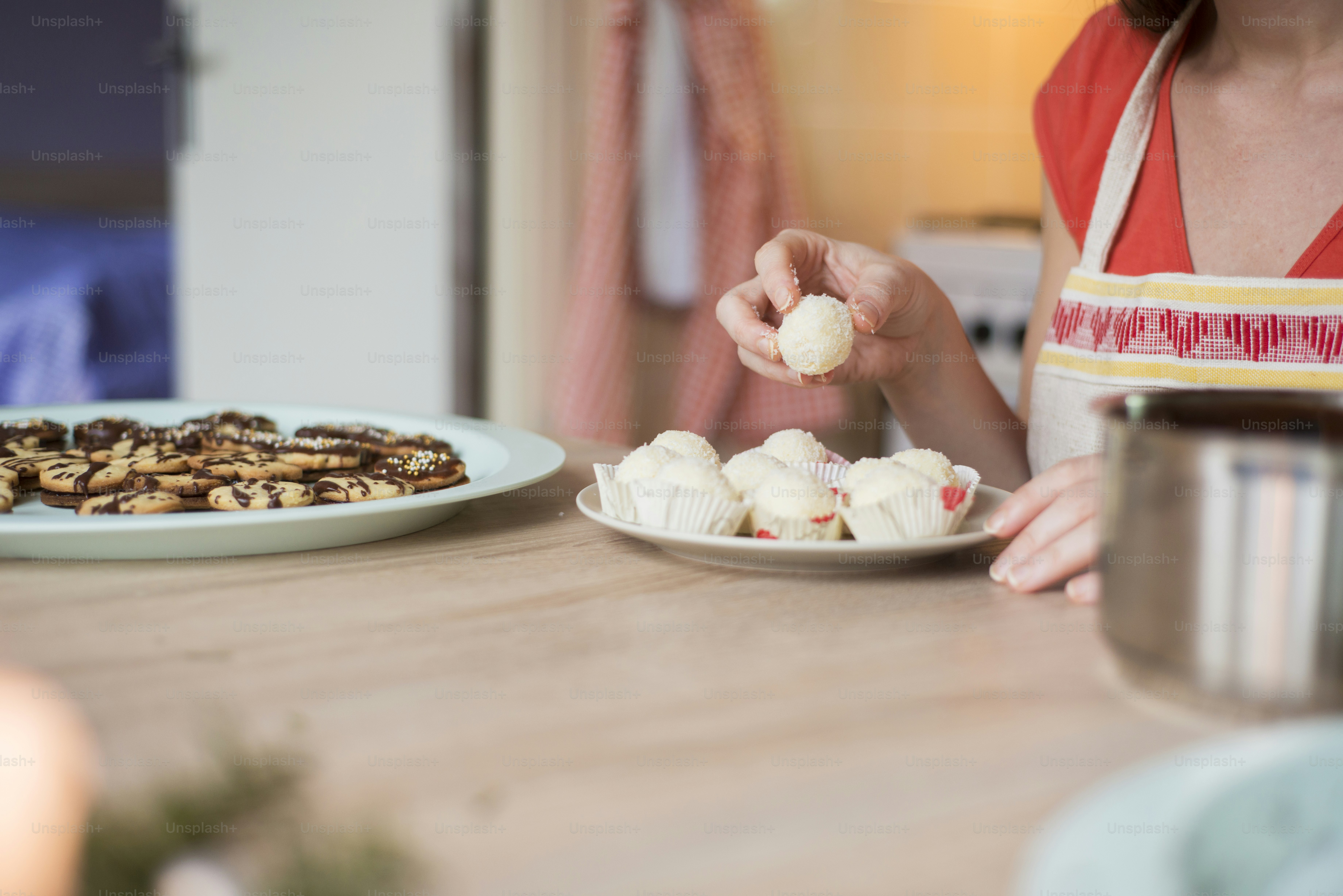 Woman is making christmas cakes in the kitchen