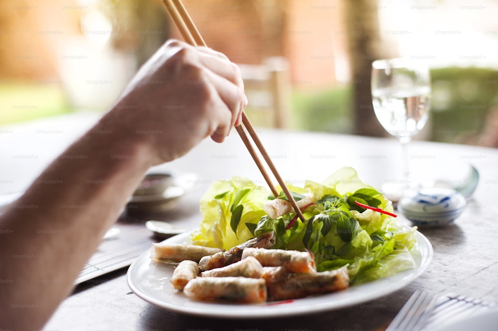 Asian vietnamese food - fresh spring rolls with basil salad and carrot