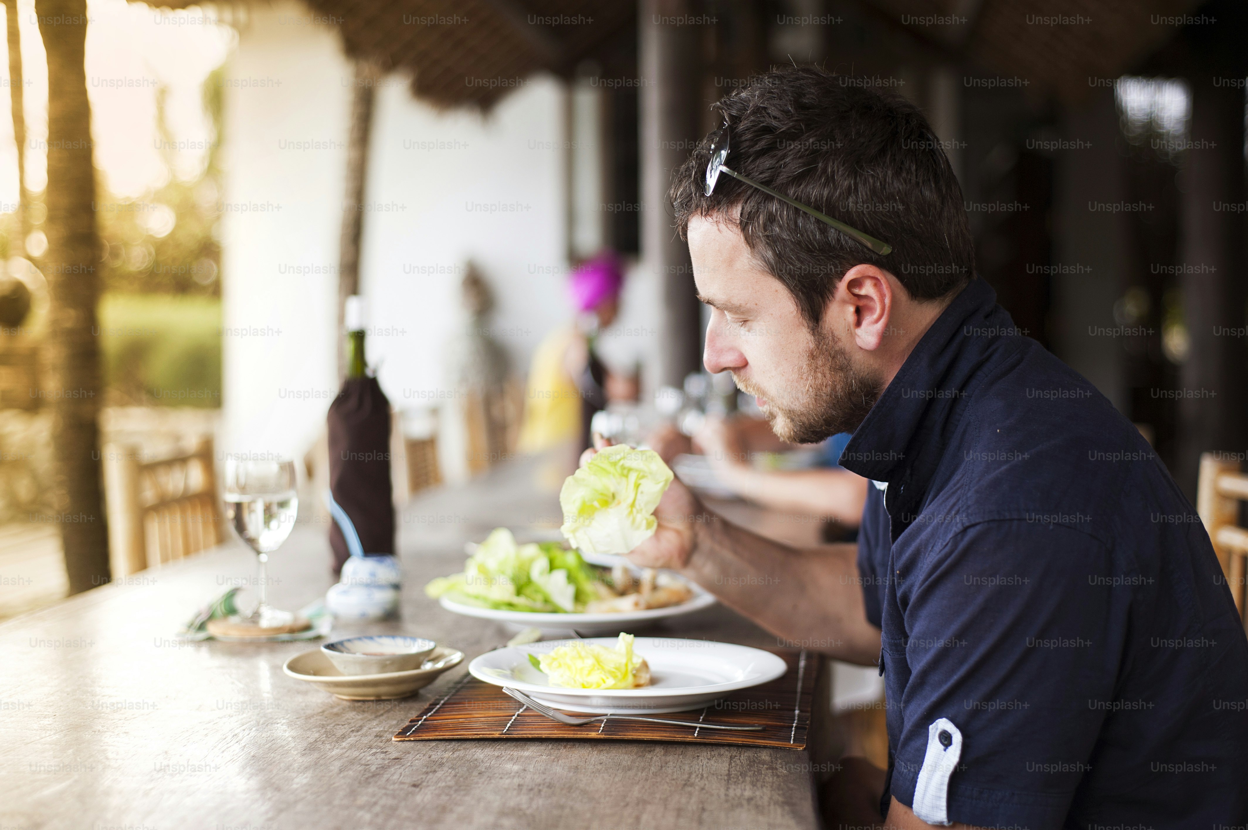 Man enjoying a meal with chopsticks in vietnamese restaurant