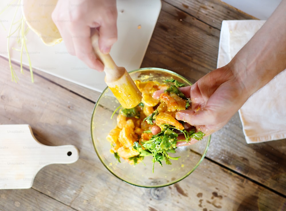 Man in the kitchen preparing prawns for a dinner