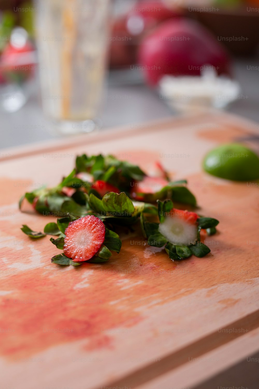Strawberries cuttings on a chopping board in kitchen, healthy lifestyle concept.