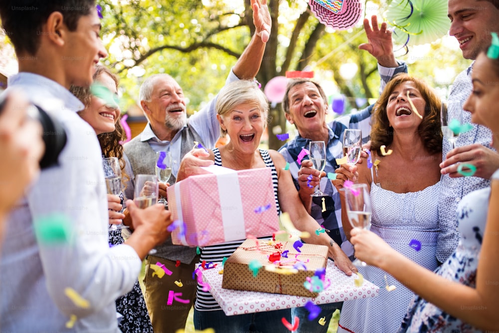 Family celebration outside in the backyard. Big garden party. Birthday party.