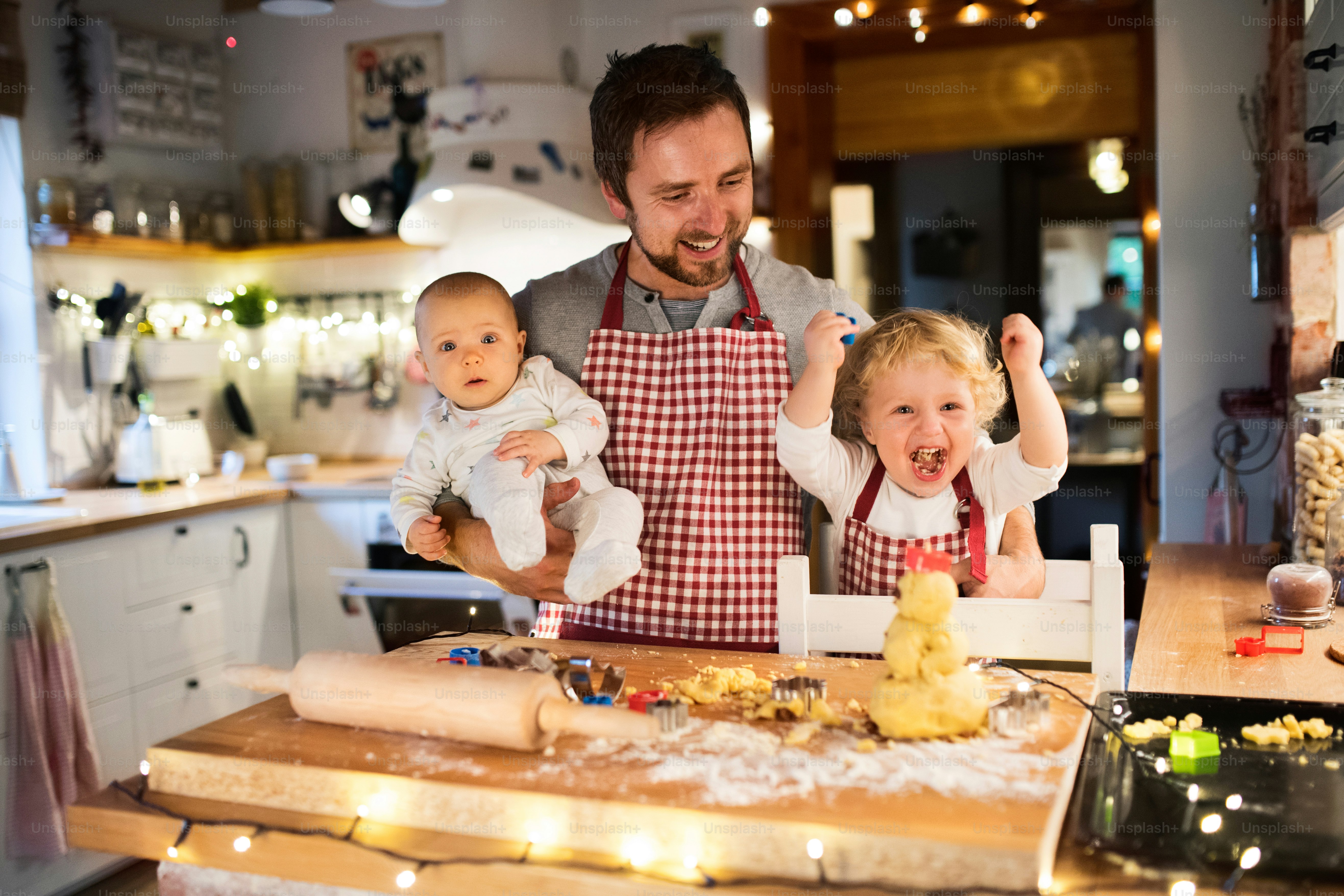 Unrecognizable woman and toddler boy making cookies at home. Mother and ...