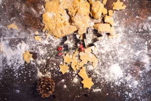 Gingerbread cookies making at Christmas time. Baking concept background. High angle view.