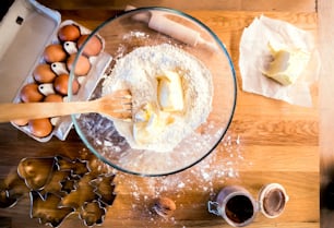 Christmas baking ingredients on the wooden table. High angle view.