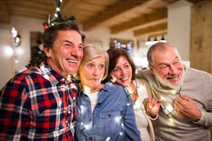 Senior friends at Christmas time, having fun.