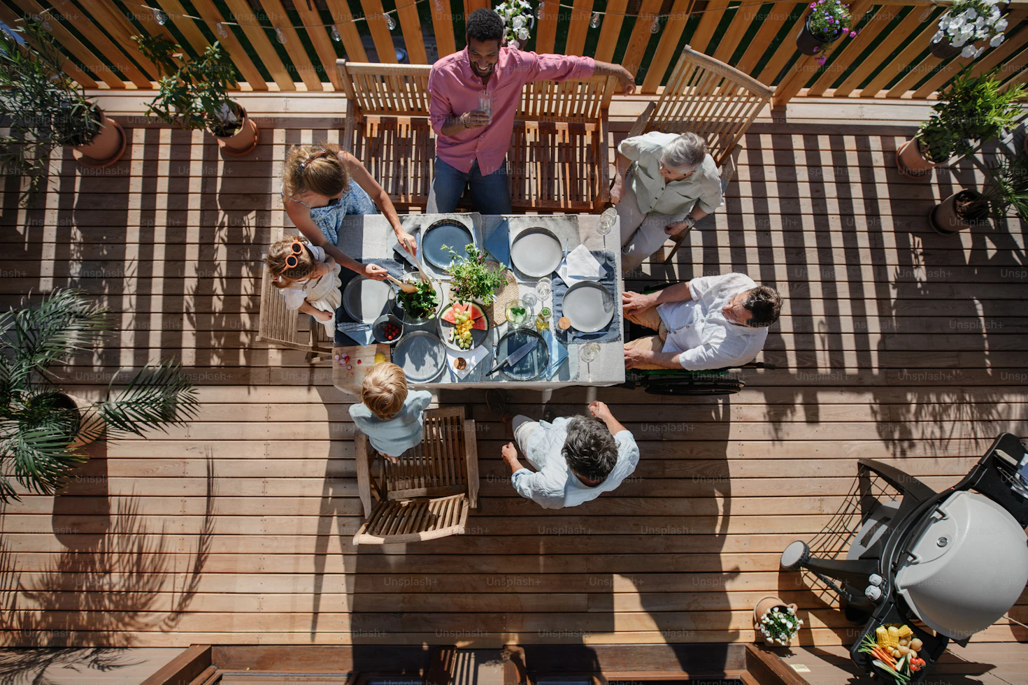 Stylish outdoor patio setup with string lights and snacks