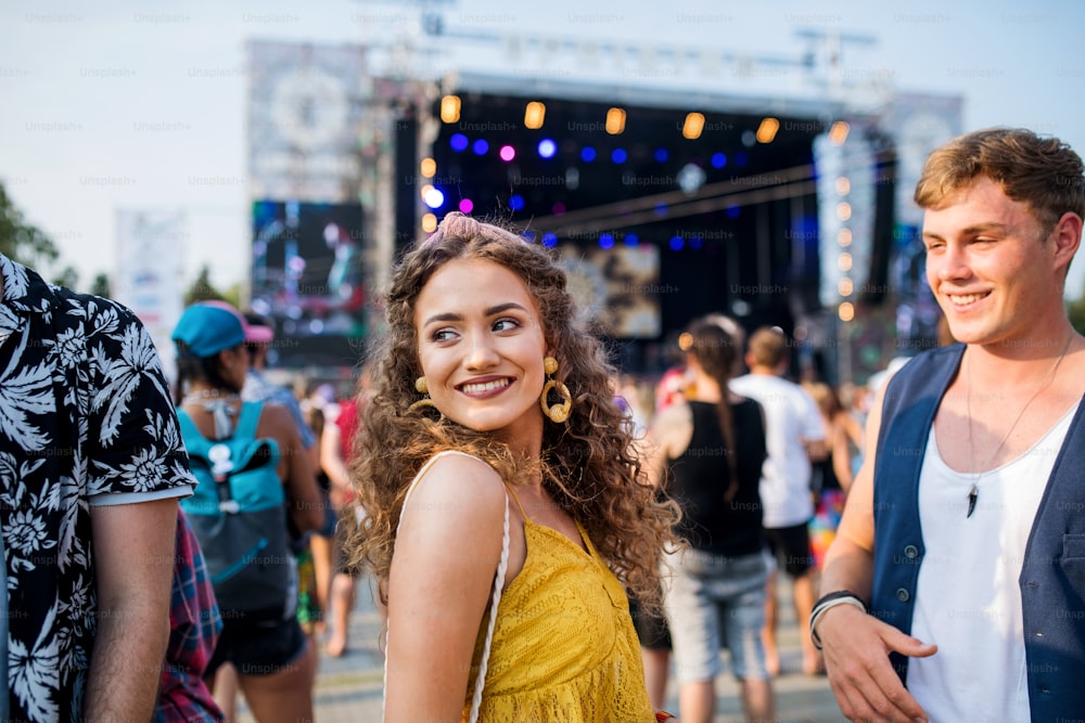 A group of cheerful young friends at summer festival.