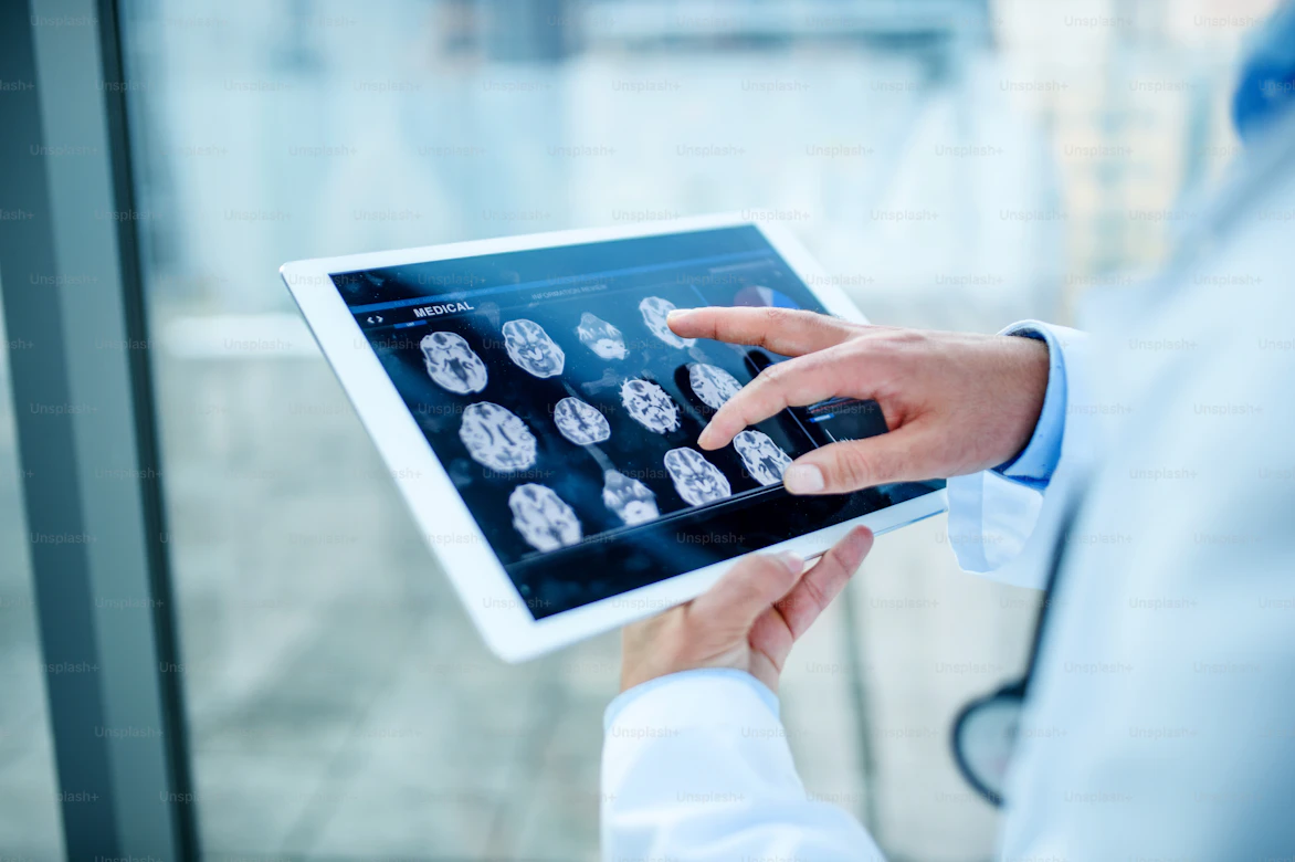 Specialist reviewing radiology scans