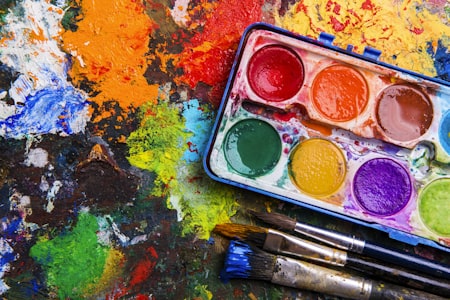 Watercolor paint palette and brushes