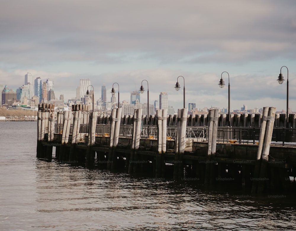 a pier with a city in the background