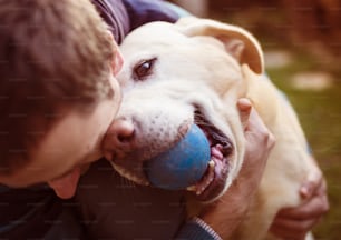 Man having fun and playing with his dog